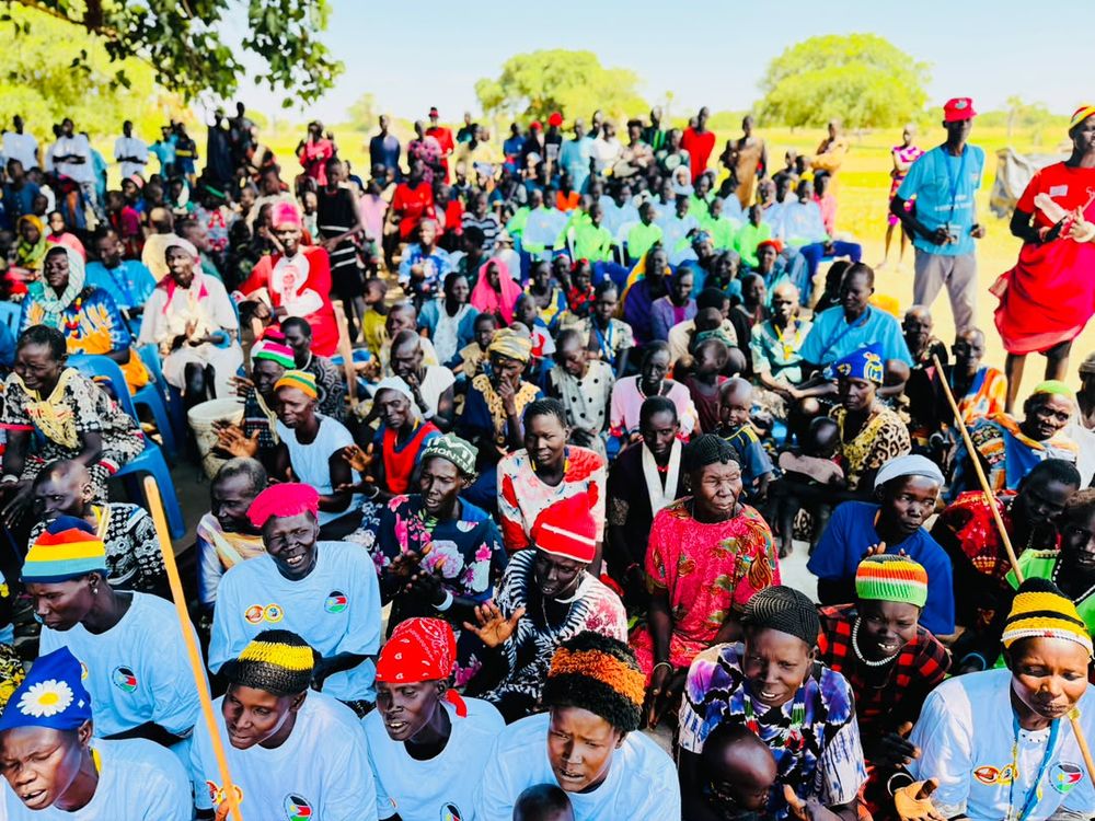 Community gathering in full colour and number