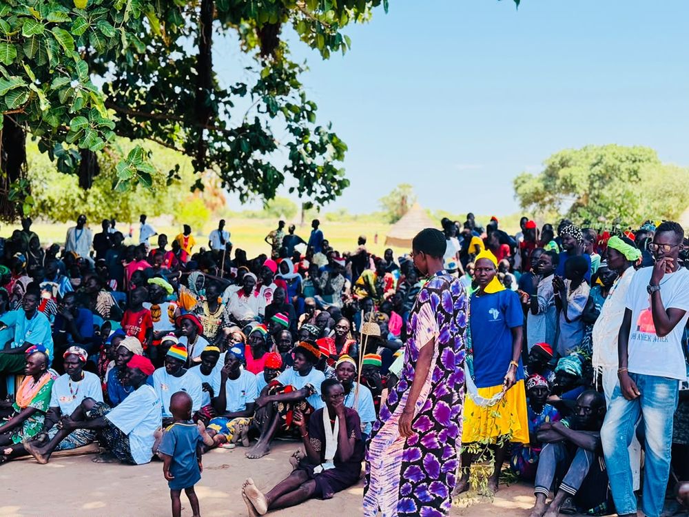 Addressing the community at a public meeting