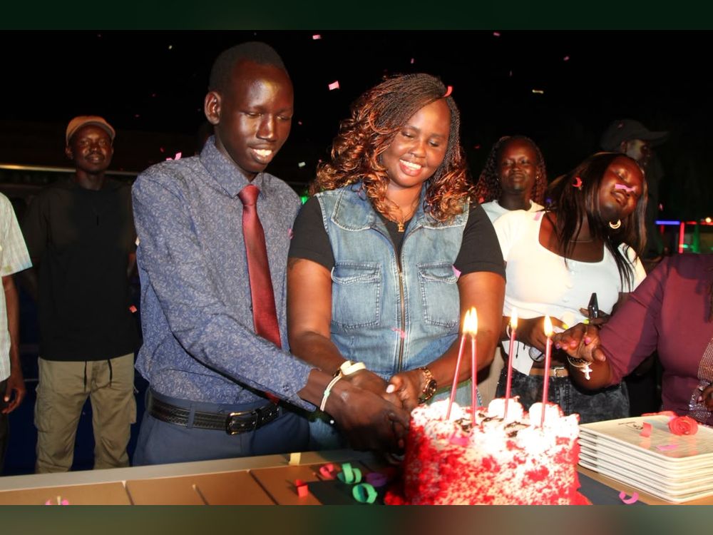 Cutting the cake at a community celebration