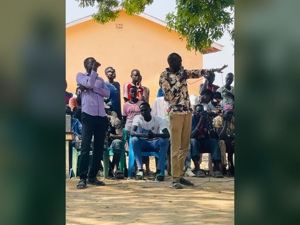 A speaker takes questions from the gathering