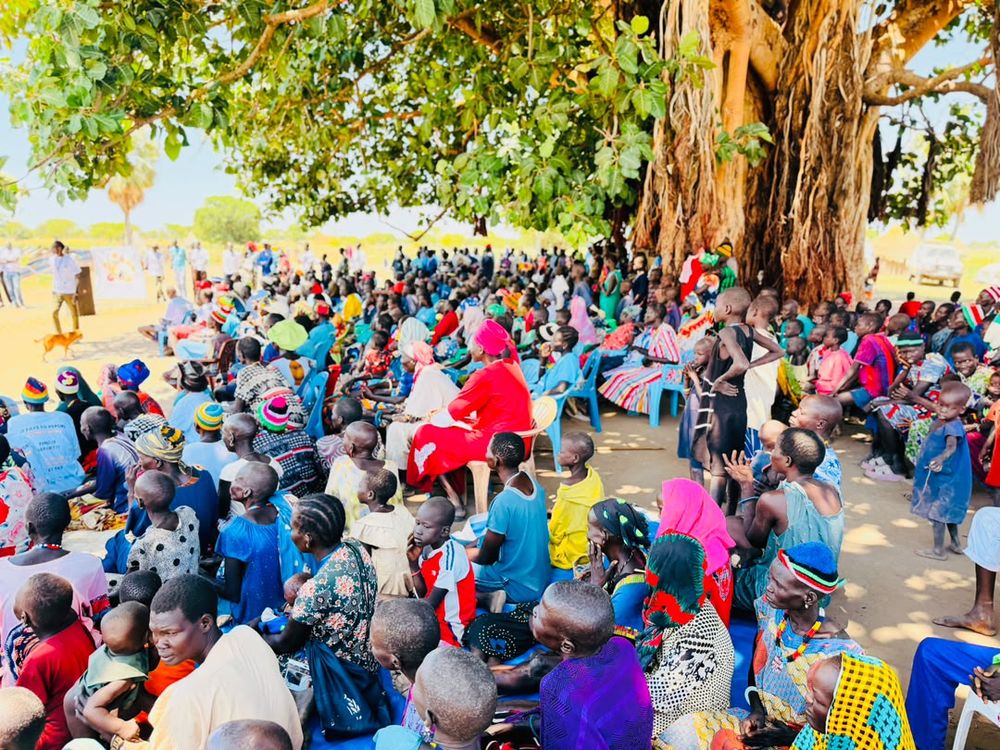 A packed community gathering